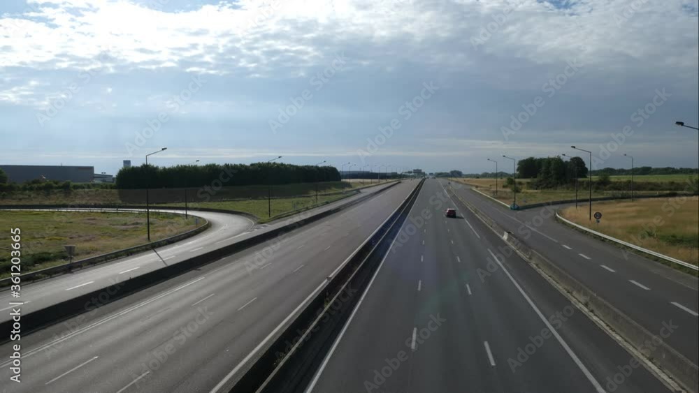 Timelapse of cars on a highway during the day. Movement of accelerated vehicles on the road as seen from a bridge. Timelapse of cars on a highway during the day. Movement of accelerated vehicles on the road as seen from a bridge.
