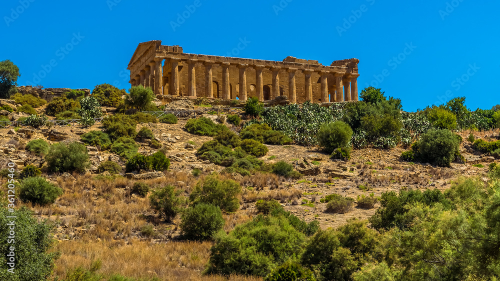 The Temple of Concordia on the summit of a ridge above the plain around the Sicilian city of Agrigento, in summer