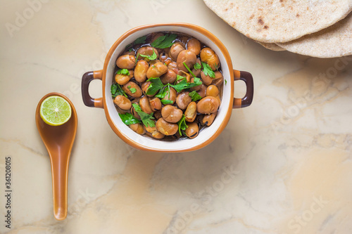 Ful Medames - Dish of Egyptian fava beans with lemon ,cumin ,vegetable