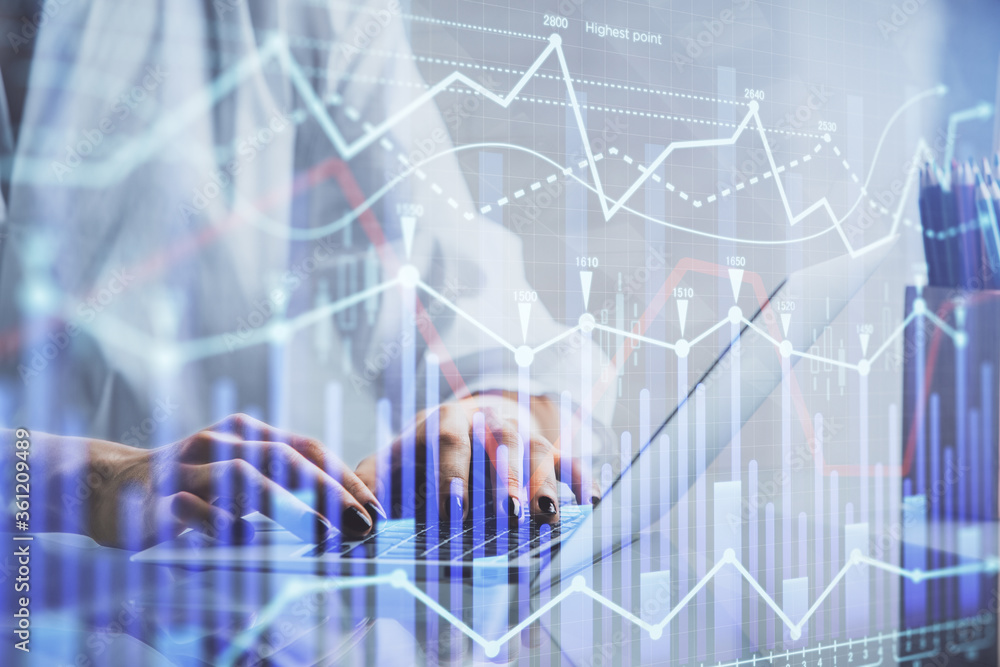 Double exposure of woman hands typing on computer and forex chart hologram drawing. Stock market invest concept. Double exposure of woman hands typing on computer and forex chart hologram drawing. Stock market invest concept.