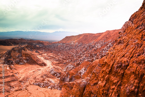 landscape of death valley / mars valley with red rock range and white salt layer and clouds #3