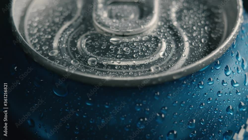 Water drop droplets on wet aluminum can of soft drink. Extreme macro close up. Alcohol drink for thirst. Cold beverage. Energy drink Water drop droplets on wet aluminum can of soft drink. Extreme macro close up. Alcohol drink for thirst. Cold beverage. Energy drink