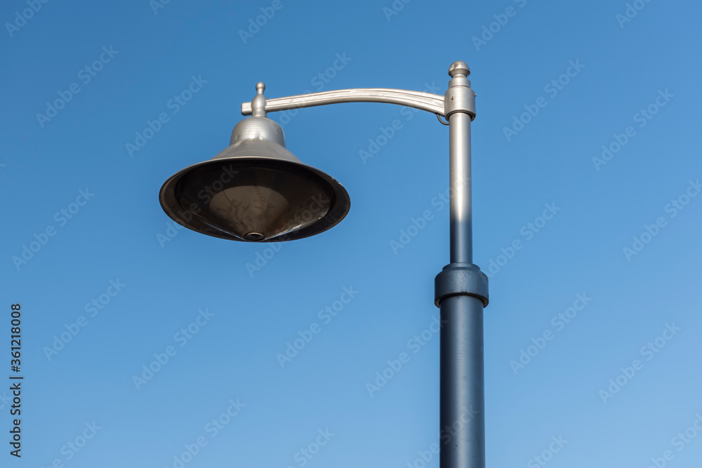 The street light at the street with blue sky. The street light at the street with blue sky.