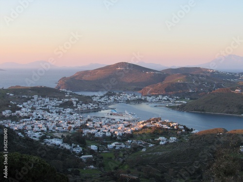 View of the port on Patmos, Greece with the sunset and ocean in the background