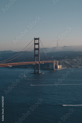golden gate bridge san francisco with lines of boats in the ocean