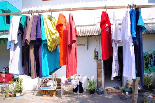 hanging clothes front of house © nature4444