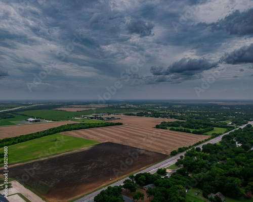 Moody Cloudy Sky over small town Hillsboro Texas Farm Fields
