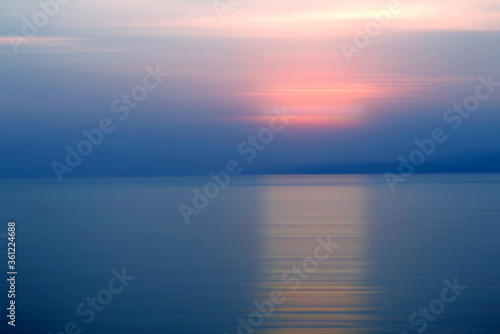 Abstract background motion blur sunset on the sea