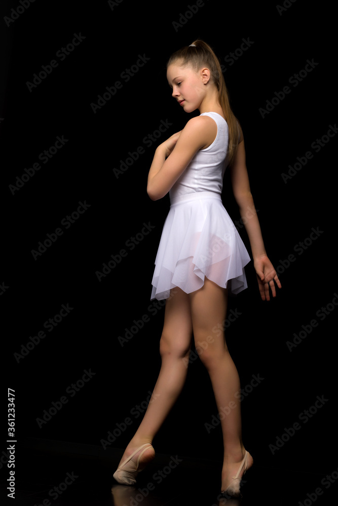 Full length portrait of a charming gymnast girl in elegant dress. Full length portrait of a charming gymnast girl in elegant dress.