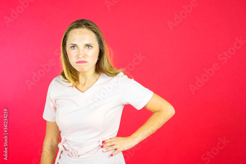 Angry young woman looking at camera