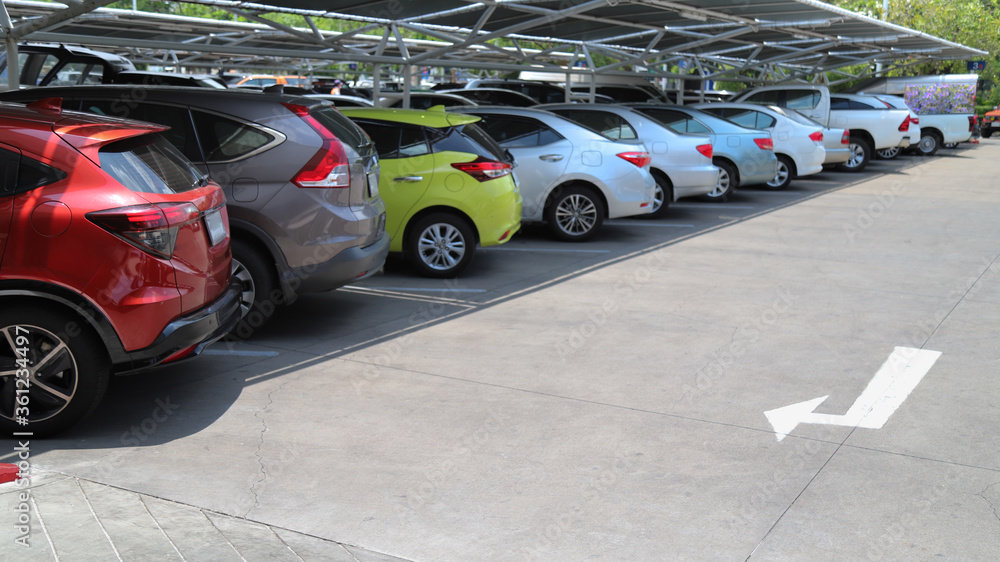 Closeup of rear, back side of red car with other cars parking in indoor parking area. Closeup of rear, back side of red car with other cars parking in indoor parking area.