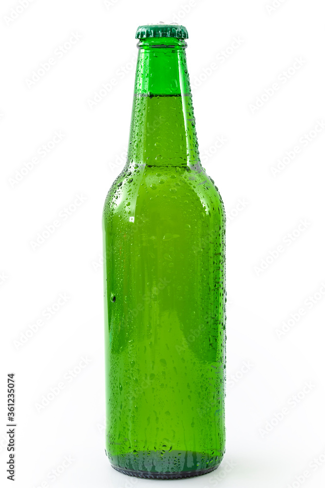 Cold refreshment and alcoholic beverages concept with picture of wet generic green bottle of beer without branding covered in water droplets isolated on white background with clipping path cutout Cold refreshment and alcoholic beverages concept with picture of wet generic green bottle of beer without branding covered in water droplets isolated on white background with clipping path cutout
