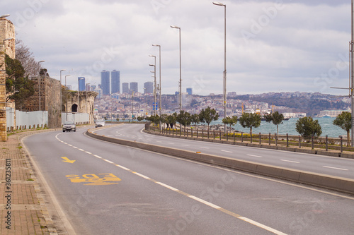 Bild auf Leinwand Istanbul, Turkey-March, 19, 2020, the road along the ancient wall and the sea