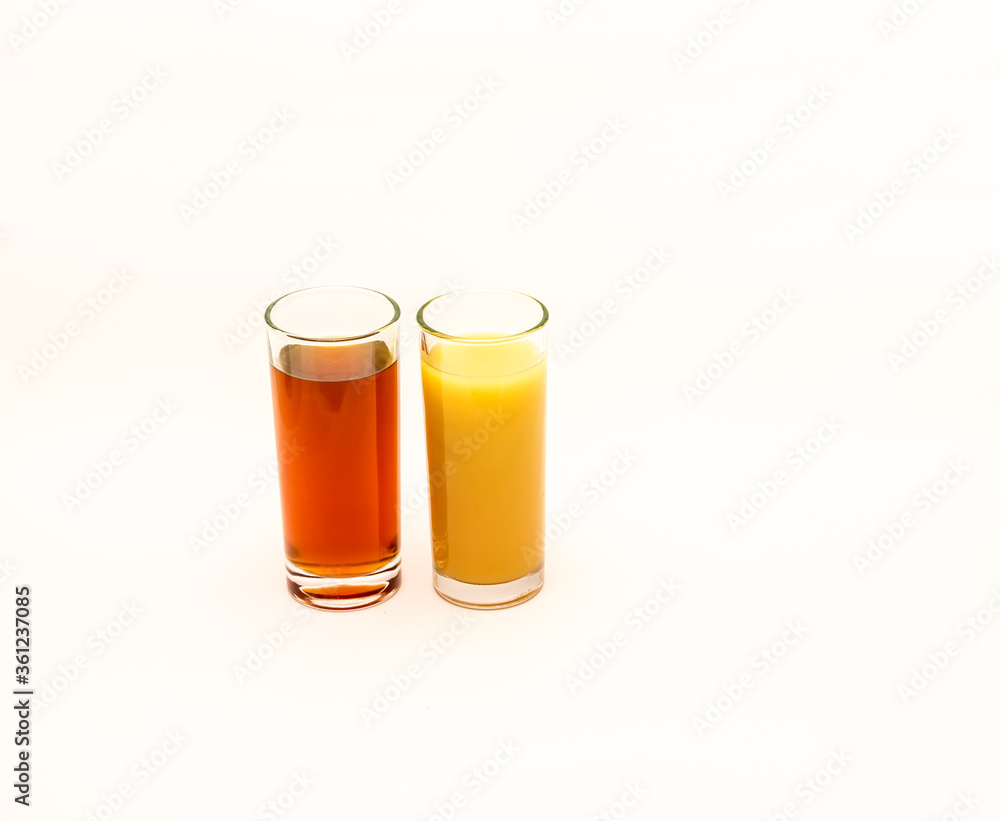 Delicious freshly squeezed fruit juice isolated against a white background Delicious freshly squeezed fruit juice isolated against a white background