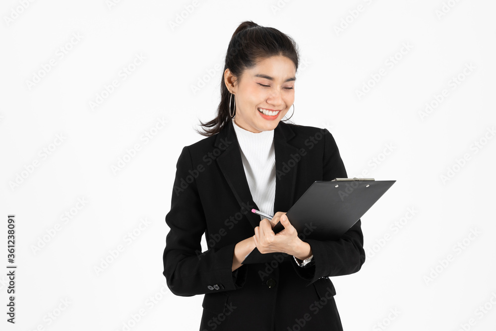 Portrait of confident young Asian business woman holding document folder or ring binder posing over white isolated background. Portrait of confident young Asian business woman holding document folder or ring binder posing over white isolated background.