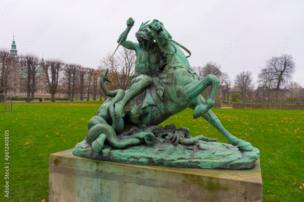 Sculpture Fight with Snake in Rosenborg Castle Gardens or The Kings Garden in Copenhagen.