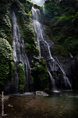 Banyumala twin waterfall in the forest of central tropical Bali, Indonesia. Travel adventures.