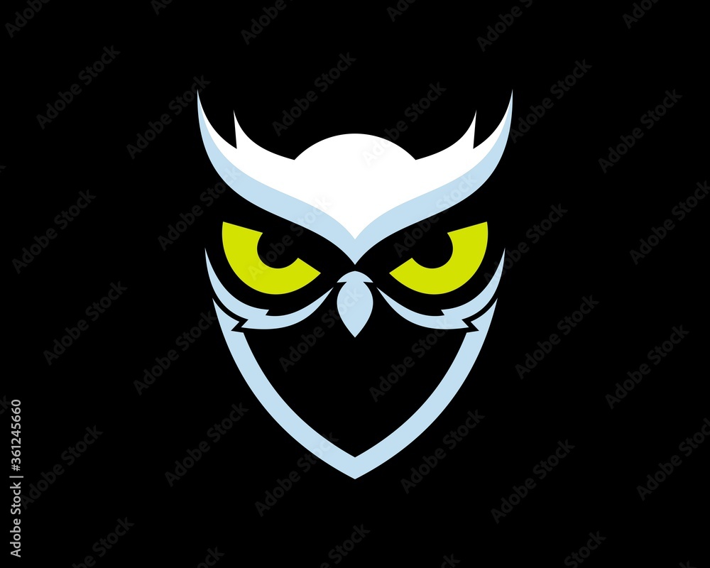 Owl head and yellow eyes with shield shape Owl head and yellow eyes with shield shape