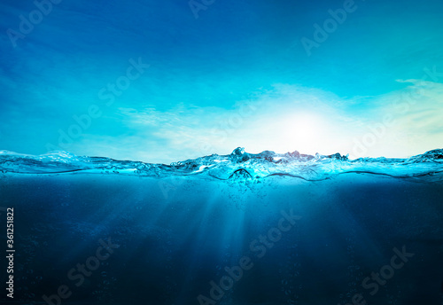 blue ocean underwater , deep ocean, blue water waves with sun beam clear view realistic, world oceans day banner with copy space, world ocean day fresh water lake, sea water