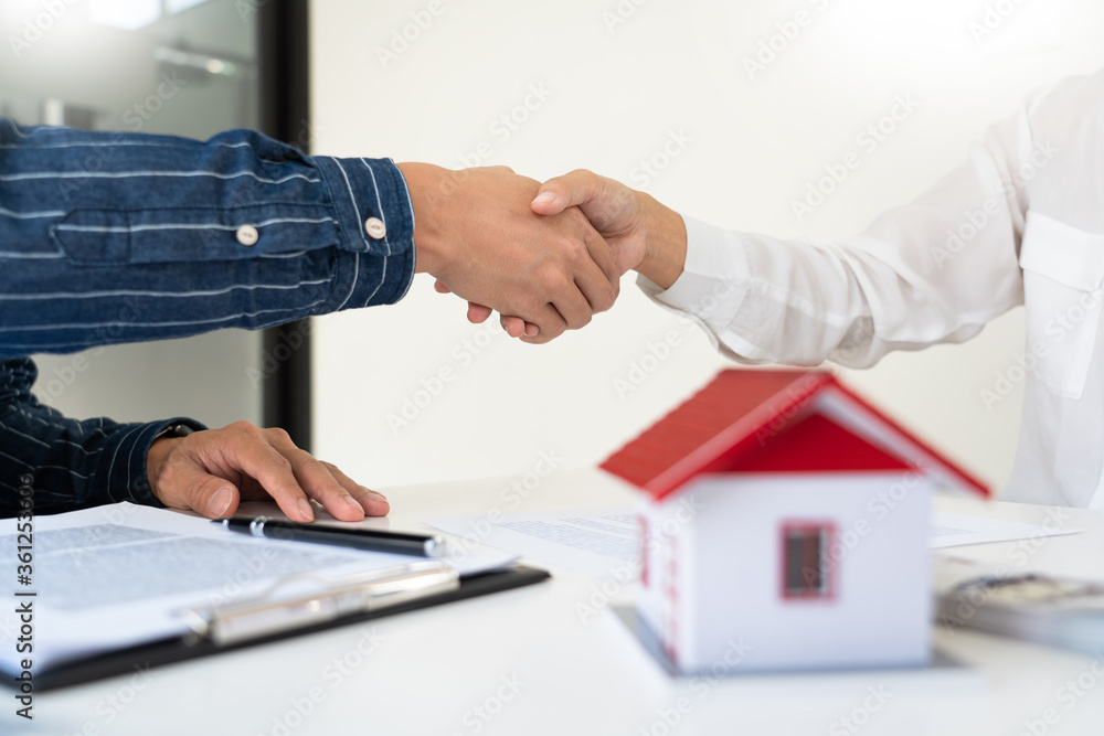 House developers and customer shaking hand after accept agreement finish buying asset