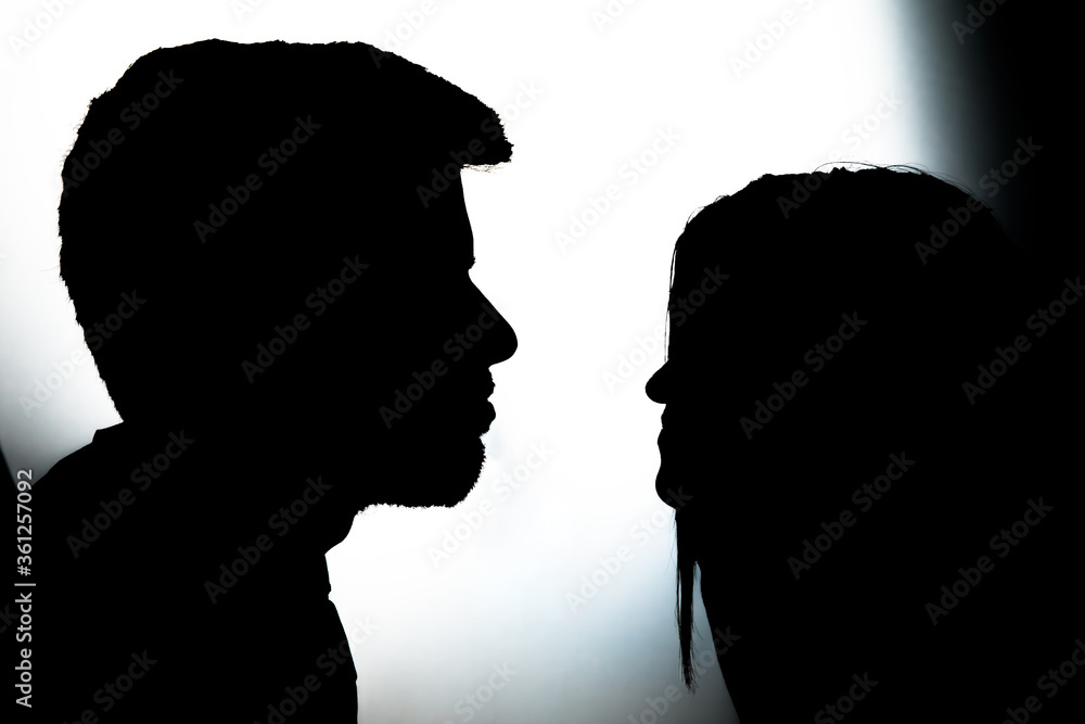 Silhouettes of man and woman.