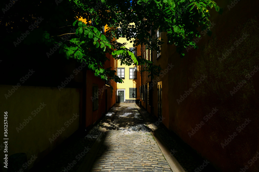 Stockholm, Sweden June 29, 2020 A house and strong afternoon shadows on Tradgardsgatan in the Old Town or Gamla Stan.