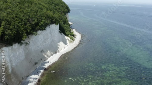 Drone Aerial Shot of the chalk cliffs on Ruegen Rügen in Germany in beautiful light with green and blue seawater, Europe photo