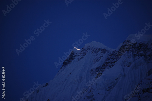 snow covered mountain at night