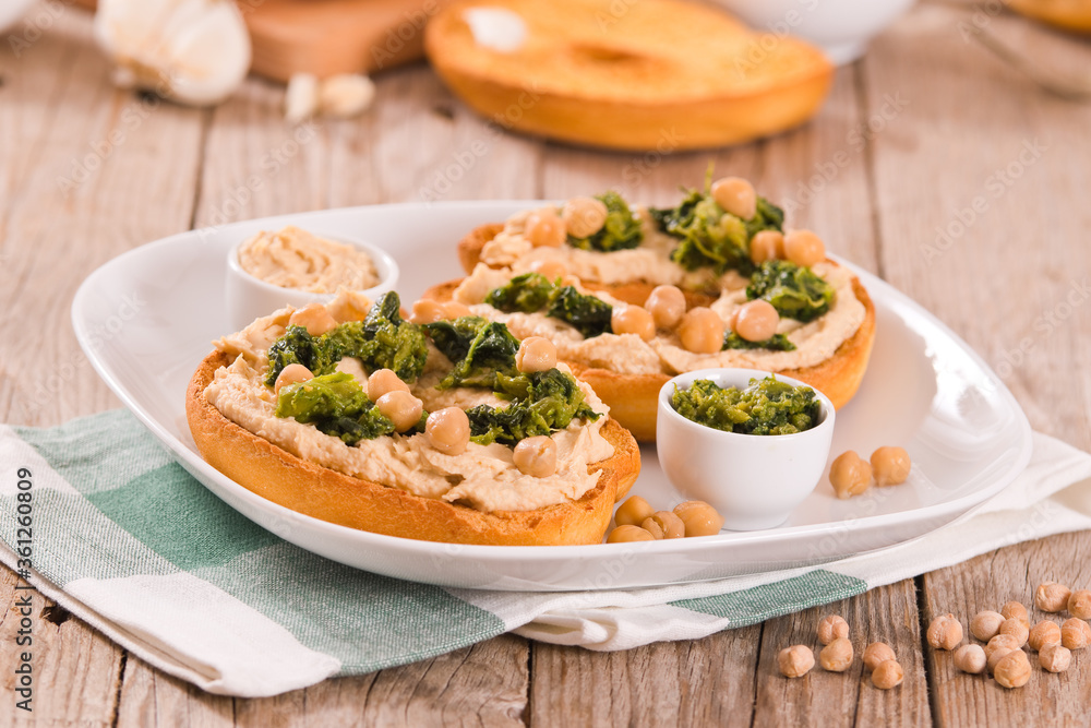 Friselle with turnip tops and hummus.
