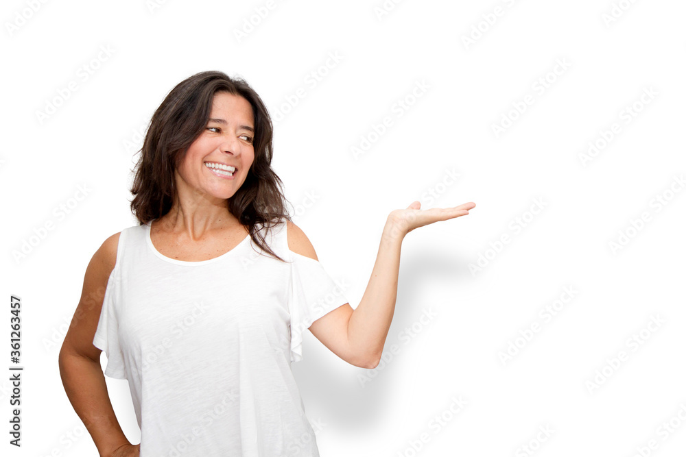 Good looking attractive middle-aged brunette woman with long hair, with a positive attitude, raises her left hand to show something Good looking attractive middle-aged brunette woman with long hair, with a positive attitude, raises her left hand to show something