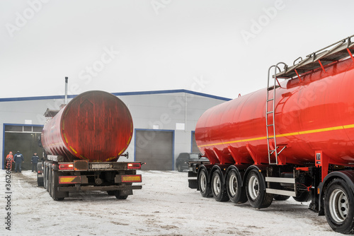 Oil truck in the parking lot in winter in front of the service station