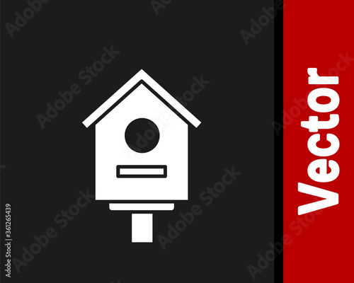 White Bird house icon isolated on black background. Nesting box birdhouse, homemade building for birds. Vector Illustration.