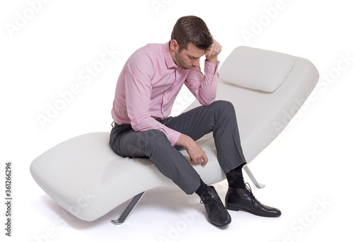 Man client sitting with psychologist on the comfortable couch