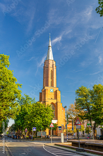 Kreuzkirche or Holy Cross Evangelical Church building in Bonn historical city centre, blue sky background, North Rhine-Westphalia region, Germany photo