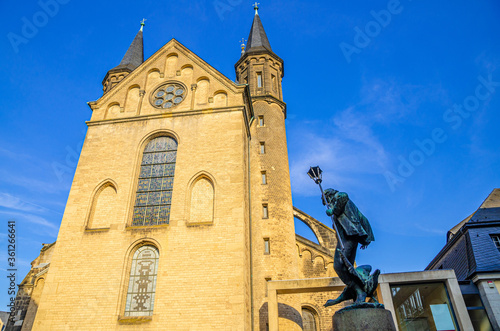 Bonn Minster or Bonner Munster Roman Catholic church Romanesque architecture building and Martinsbrunnen Martin fountain in historical city centre, North Rhine-Westphalia region, Germany photo