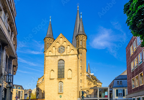 Bonn Minster or Bonner Munster Roman Catholic church Romanesque architecture building in historical city centre, blue sky background, North Rhine-Westphalia region, Germany