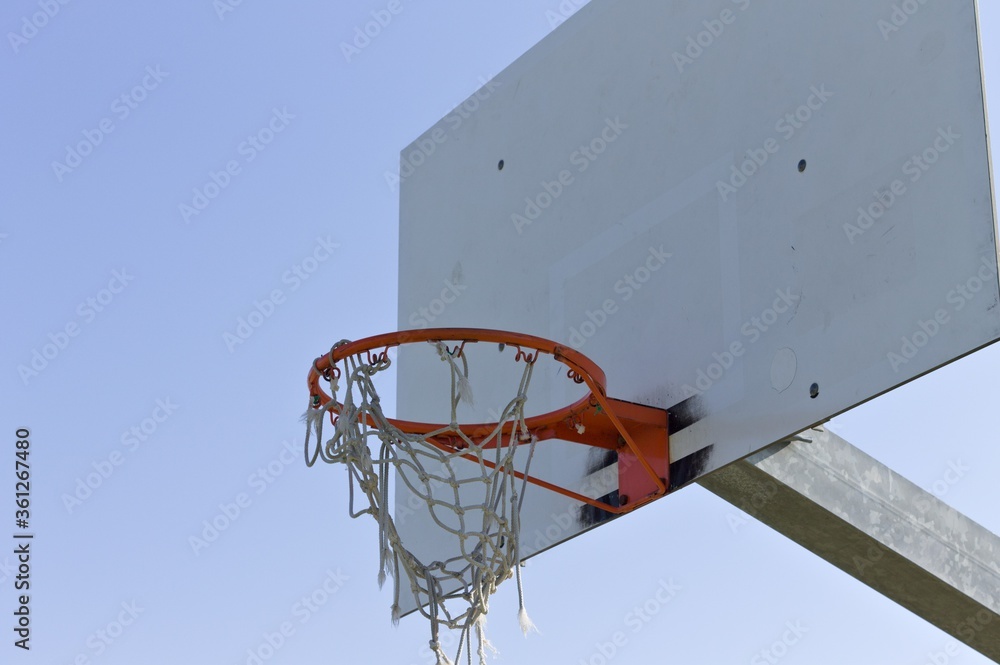 Basketball hoop with the net hooked to the basketball ring (Pesaro, Italy, Europe)
