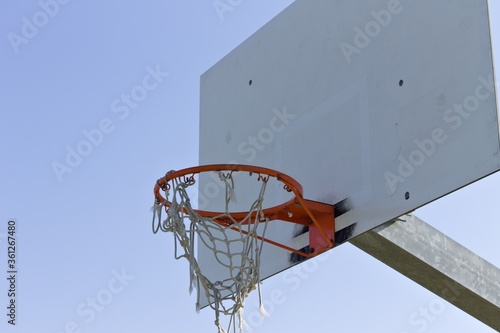 Basketball hoop with the net hooked to the basketball ring (Pesaro, Italy, Europe) © Tommaso