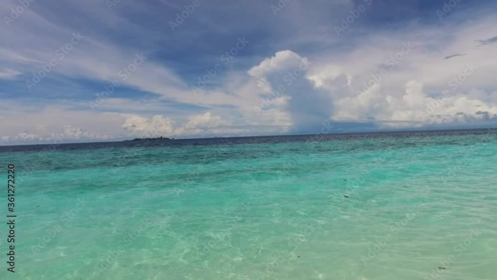 Maldives. Tropical beach. Tourism day. Tranquil, turquoise seascape. Luxury resort on Maldive island. Sea background. Blue indian ocean. White sand coast. Maldives. Tropical beach. Tourism day. Tranquil, turquoise seascape. Luxury resort on Maldive island. Sea background. Blue indian ocean. White sand coast.