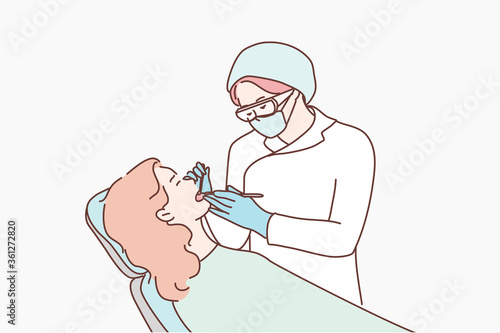 Healthcare, medicine, dentistry concept. Young woman doctor dantist checking examinates teeth of patient in special chair. Routine dental checkups procedure or toothache oral treatment illustration.