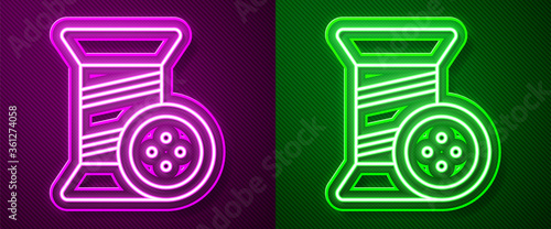 Glowing neon line Sewing thread on spool and button icon isolated on purple and green background. Yarn spool. Thread bobbin. Vector Illustration.