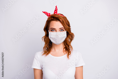 Close-up portrait of her she nice pretty healthy content girl wearing cotton safety mask mers cov contamination contagious flu flue grippe prevention healthcare isolated white gray color background