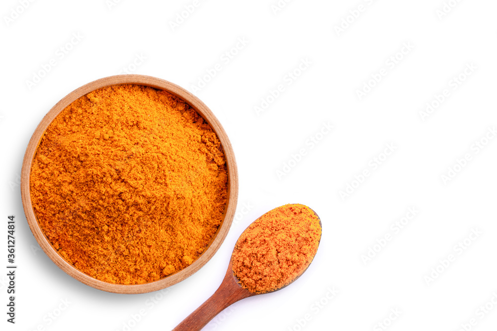 Turmeric ( curcumin, Curcuma ) powder in wooden bowl and spoon isolated on white background .Top view. Flat lay. Turmeric ( curcumin, Curcuma ) powder in wooden bowl and spoon isolated on white background .Top view. Flat lay.