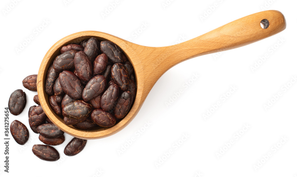 peeled cocoa beans in the wooden spoon, isolated on white background, top view peeled cocoa beans in the wooden spoon, isolated on white background, top view