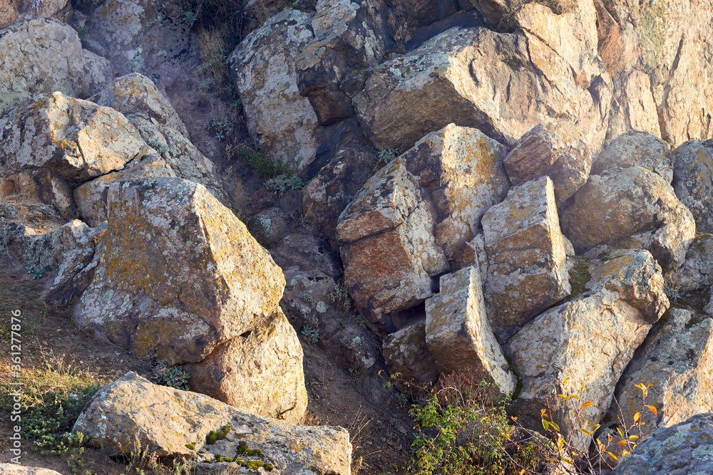 Granite boulders in the rays of the setting sun