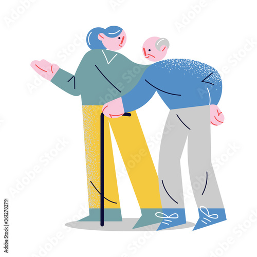 Young woman supporting, holding by hand and helping elderly man to walk