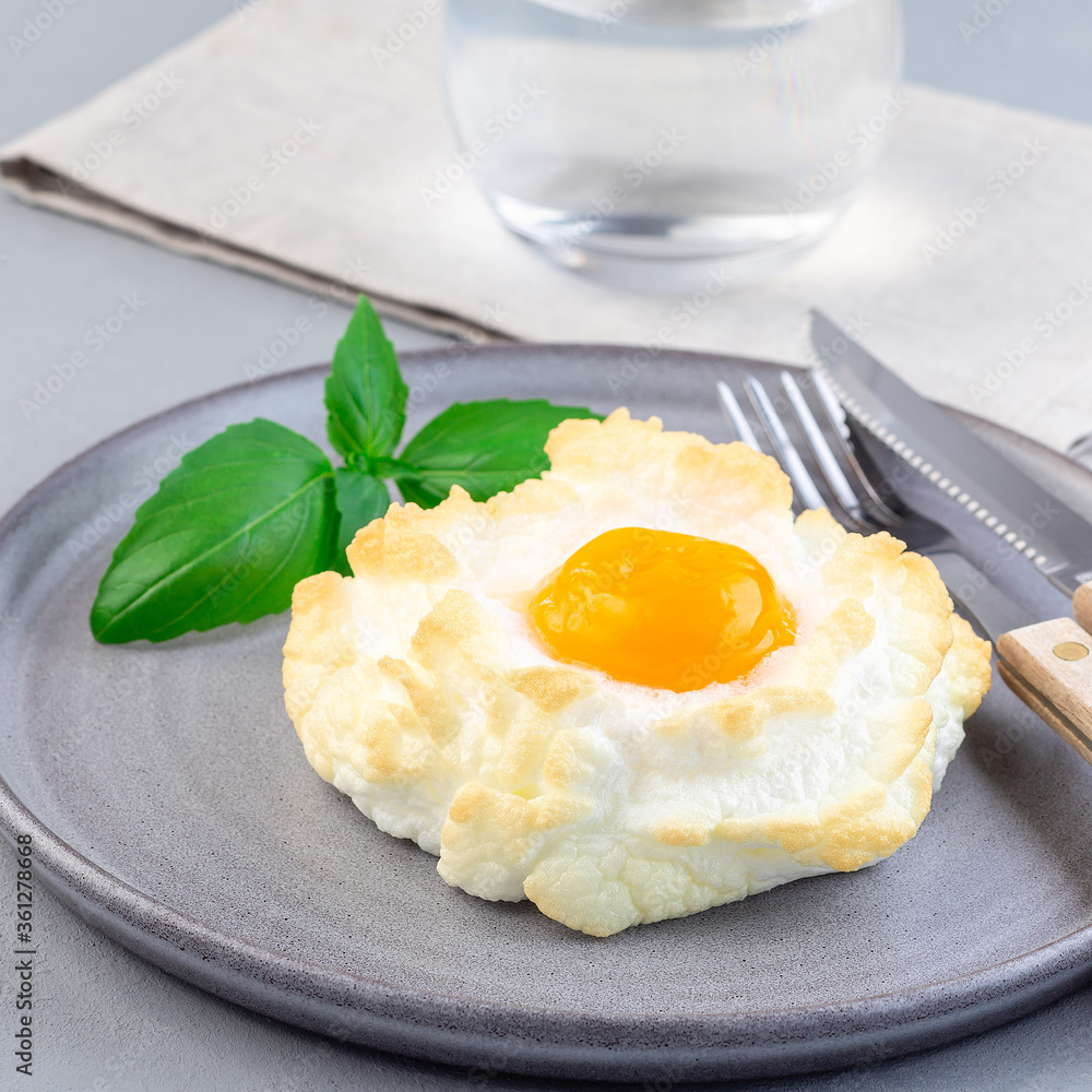Trendy cloud or fluffy egg dish on gray plate, square format Trendy cloud or fluffy egg dish on gray plate, square format
