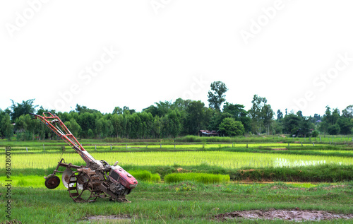Walking tractor parking at rice field in rainy season,selective focus.