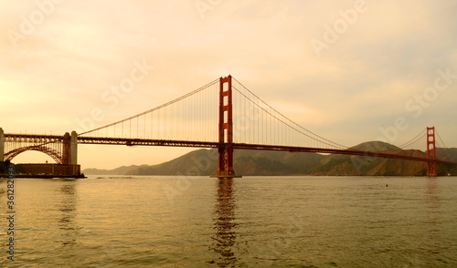Fototapeta Naklejka Na Ścianę i Meble -  San Francisco 2013, The smooth curve of the Golden gate Bridge in the bay with nice dusk colors