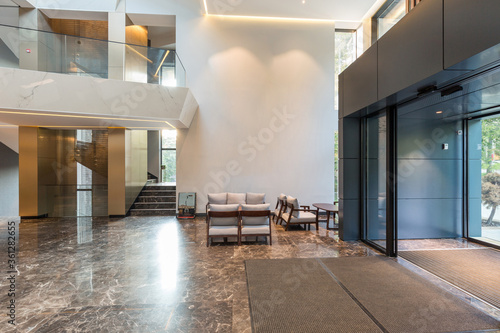Interior of a luxury hotel lobby with marble floor, entrance area photo